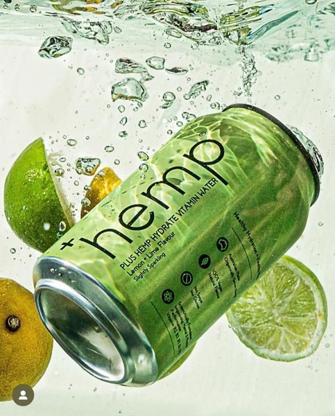 This ad creative features a can of hemp-infused vitamin water submerged in clear water with fresh lime slices, creating a clean and refreshing aesthetic.